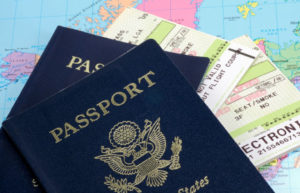two passports on top of plane tickets