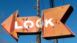 Metal Look sign pointing left