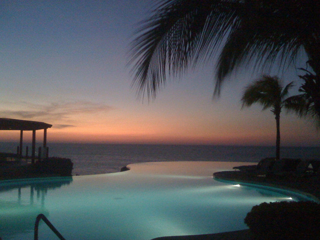 Infinity pool in Punta Mita, Mexico overlooking the ocean during sunset